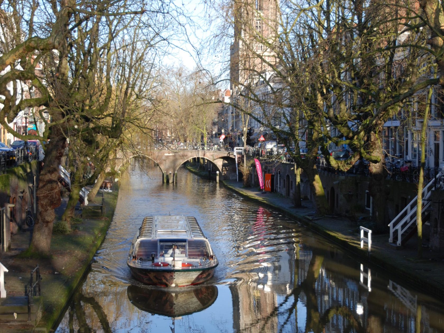 a boat on a river surrounded by trees