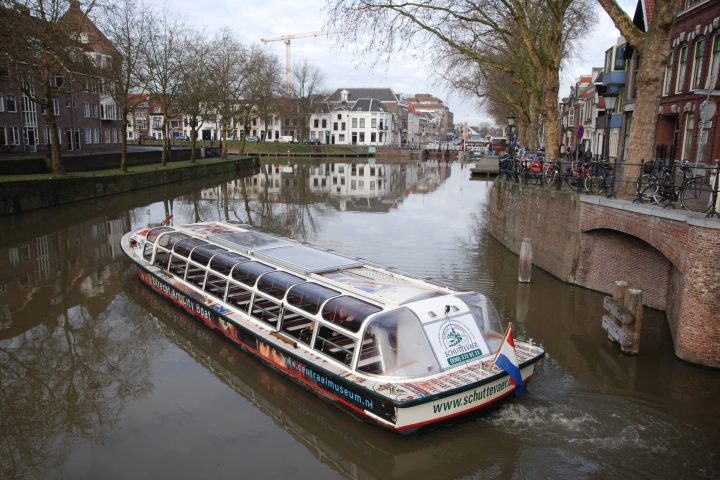 a long bridge over a river in a city