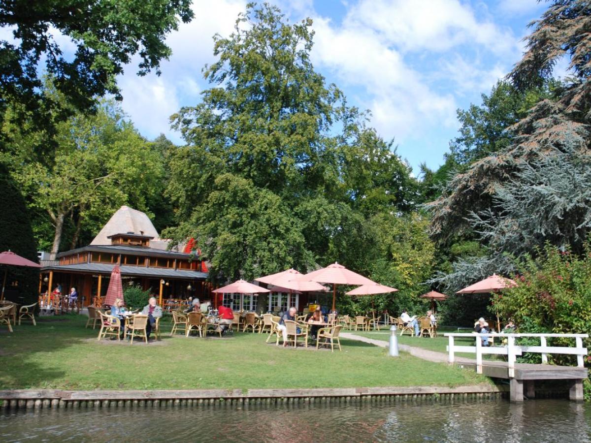 a small house surrounded by water