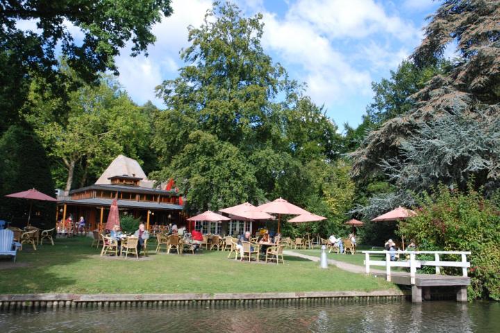 a small house surrounded by water