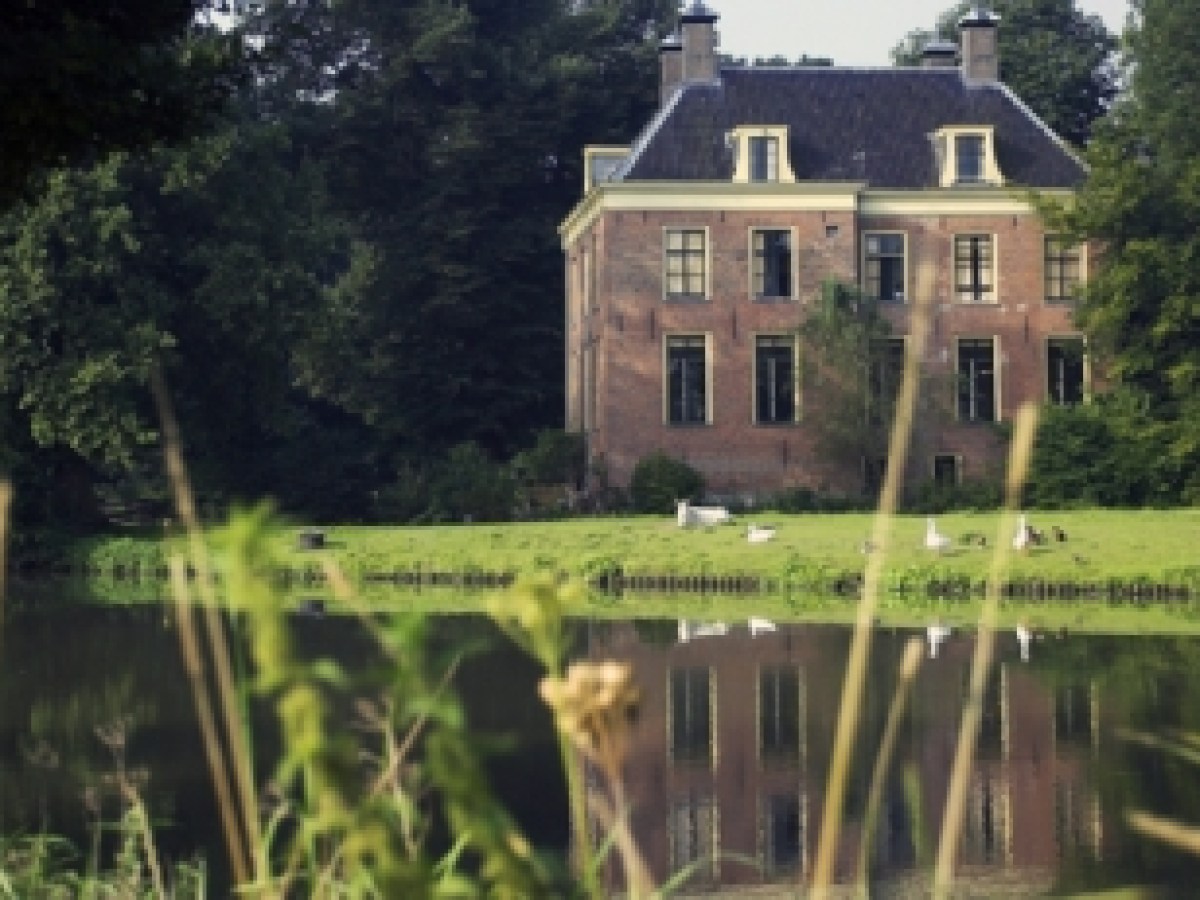 a castle on top of a grass covered field