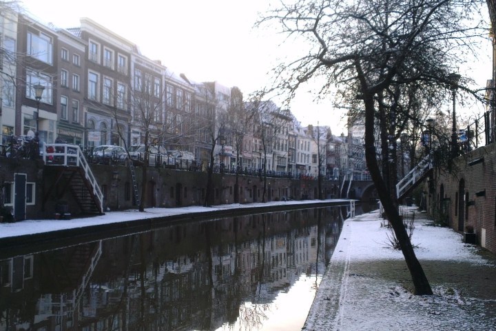 a bridge over a river in the snow
