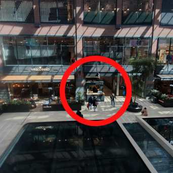 a train is parked on the side of a building