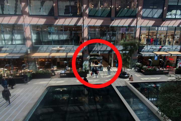 a train is parked on the side of a building