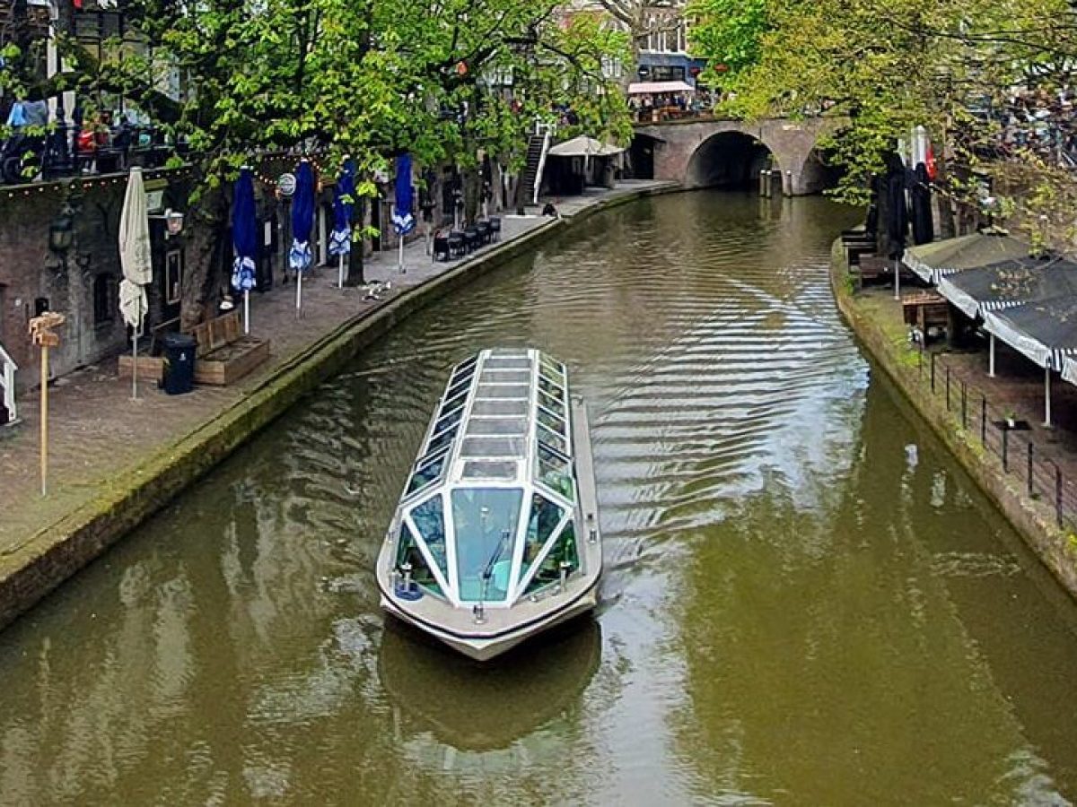 a group of people on a bridge over a river