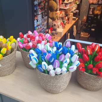 a group of colorful vases sitting on a table