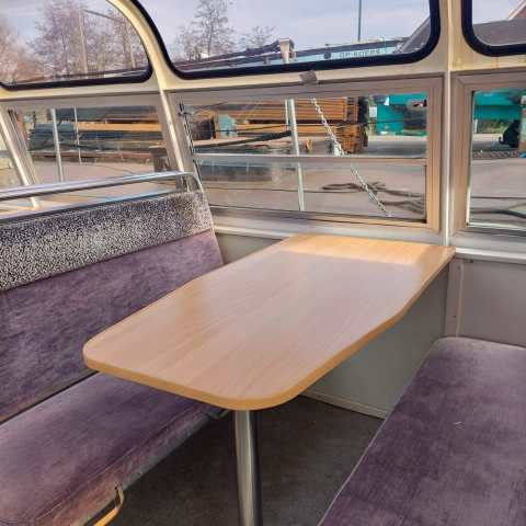 a chair sitting in front of a wooden table